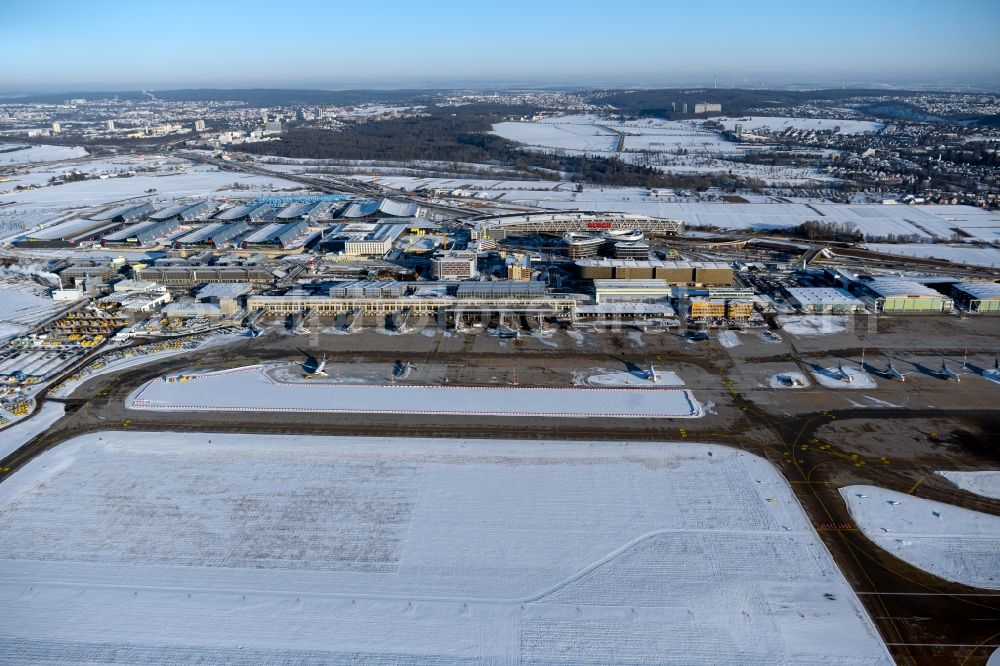 Leinfelden-Echterdingen from above - Wintry snowy dispatch building and terminals on the premises of the airport Stuttgart in Leinfelden-Echterdingen in the state Baden-Wuerttemberg, Germany