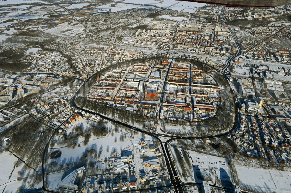 Neubrandenburg from the bird's eye view: Wintry snowy old Town area and city center in Neubrandenburg in the state Mecklenburg - Western Pomerania, Germany