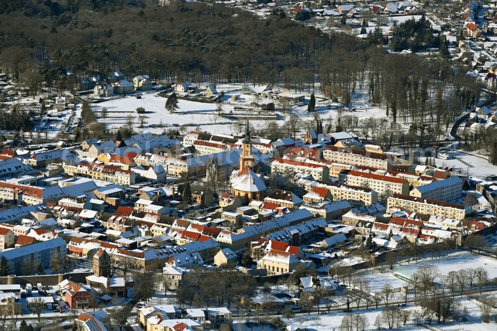 Templin from the bird's eye view: Wintry snowy old Town area and city center in Templin in the state Brandenburg, Germany