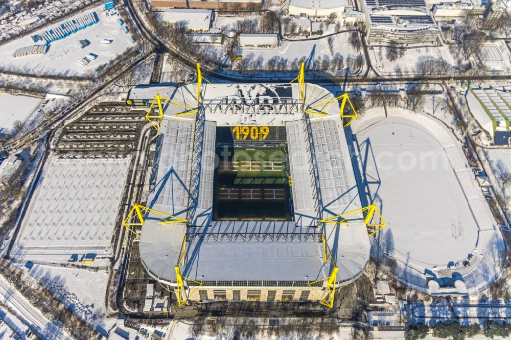 Aerial image Dortmund - Wintry snowy bundesliga stadium and sports facility grounds of the arena of BVB - Stadium Signal Iduna Park of the Bundesliga in Dortmund in the state of North Rhine-Westphalia