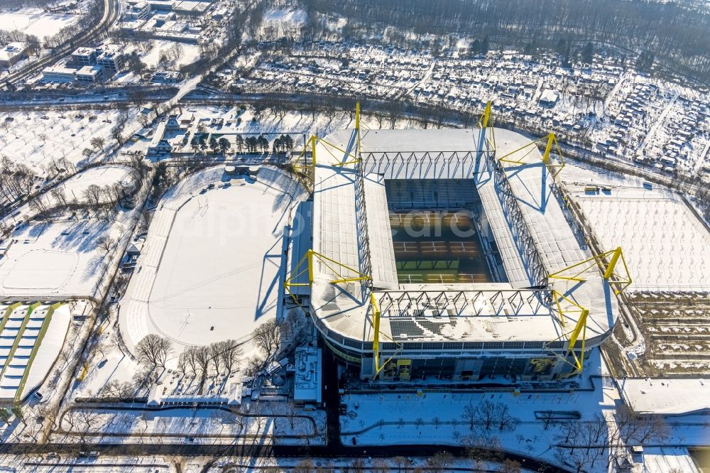 Dortmund from above - Wintry snowy bundesliga stadium and sports facility grounds of the arena of BVB - Stadium Signal Iduna Park of the Bundesliga in Dortmund in the state of North Rhine-Westphalia