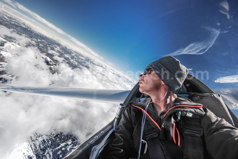 Aerial photograph La Roche-des-Arnauds - Wintry snowy View over clouds and snowy mountains from the cockpit of a DG-400 glider flying above the airspace in La Roche-des-Arnauds in Provence-Alpes-Cote d'Azur, France