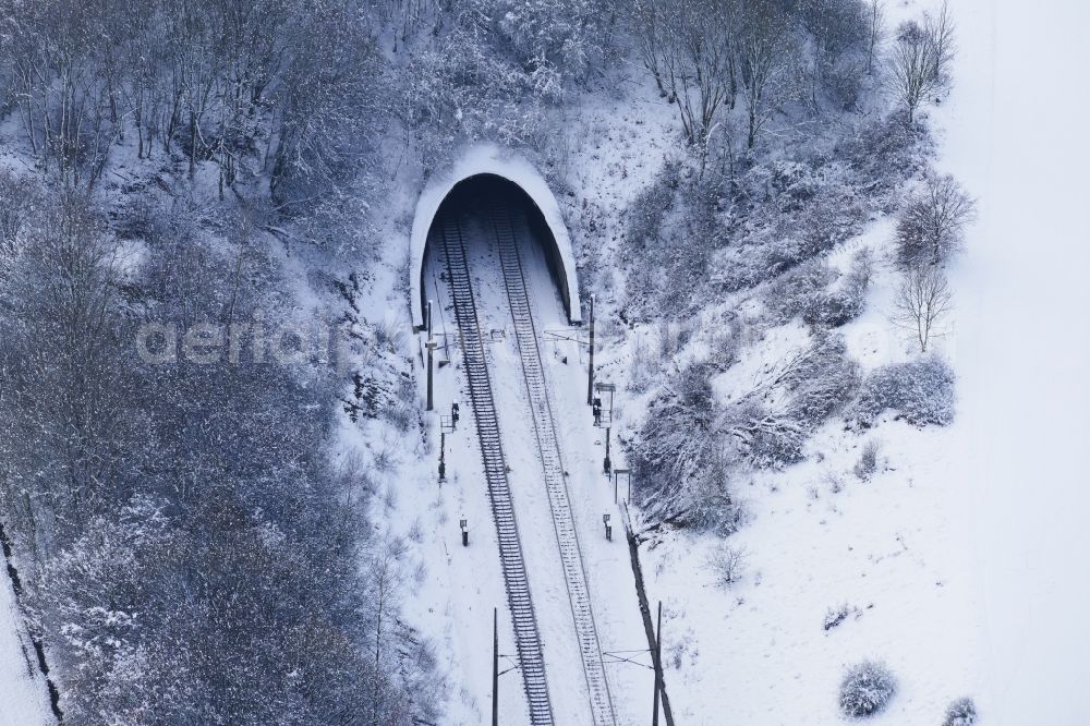 Jühnde from the bird's eye view: Wintry snowy Entry and exit area of Endelskamp Tunnel in Juehnde in the state Lower Saxony, Germany