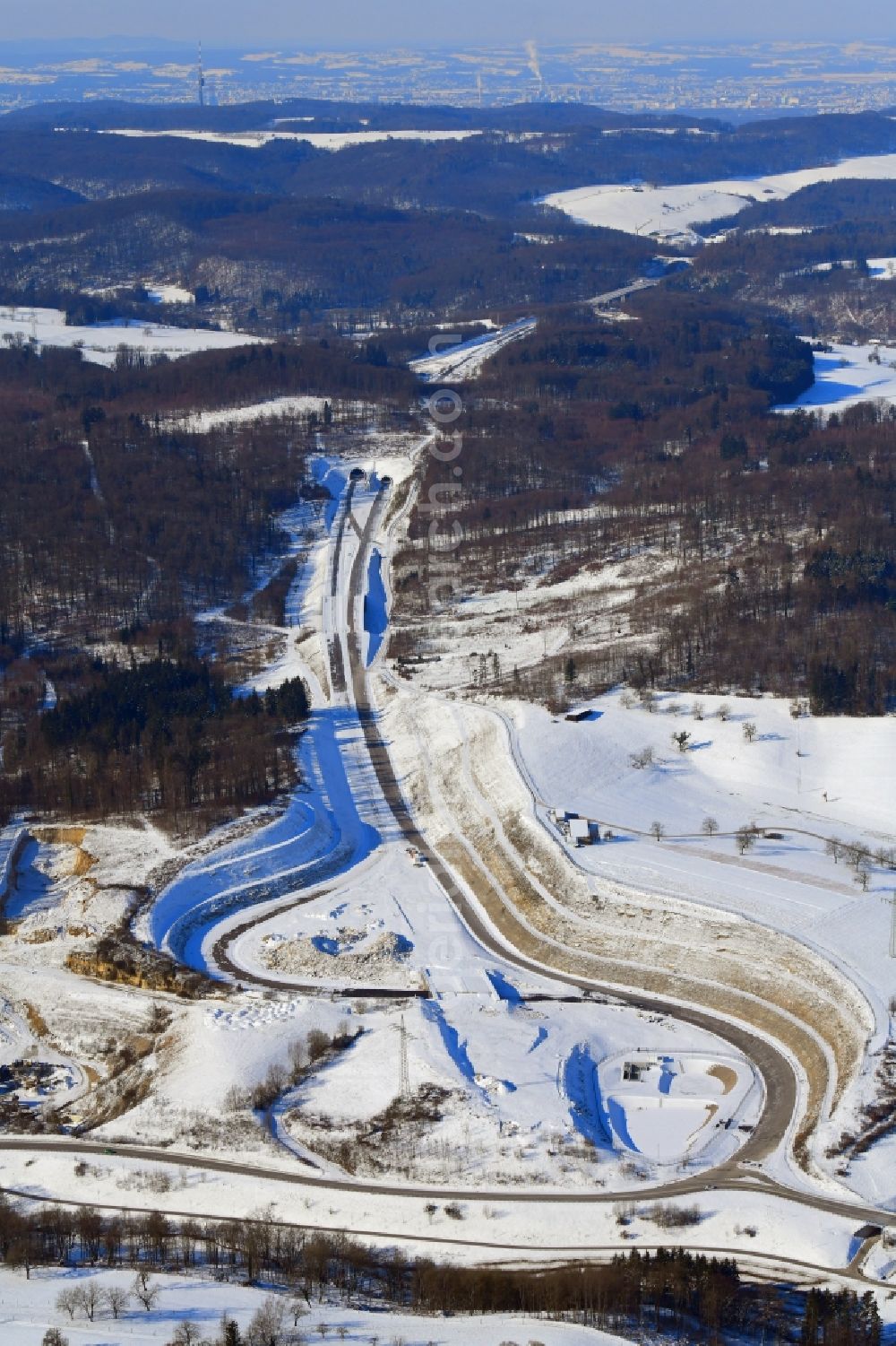 Rheinfelden (Baden) from above - Wintry snowy highway- construction site with earthworks along the route of the highway A98 at the junction Rheinfelden-East in Rheinfelden (Baden) in the state Baden-Wurttemberg, Germany