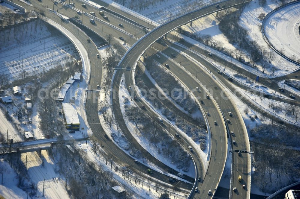 Aerial photograph Berlin - Wintry snowy highway triangle the federal motorway A 100 to the A115 Autobahndreieck Funkturm in the district Charlottenburg in Berlin, Germany