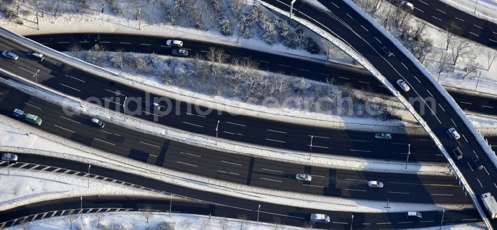 Aerial photograph Berlin - Wintry snowy highway triangle the federal motorway A 100 to the A115 Autobahndreieck Funkturm in the district Charlottenburg in Berlin, Germany