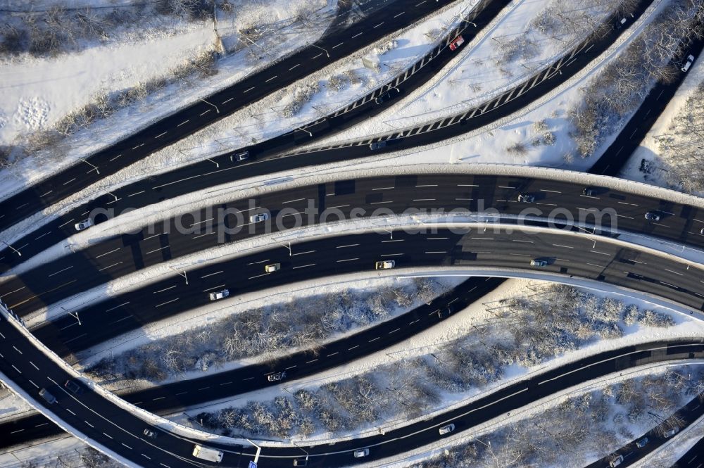 Berlin from above - Wintry snowy highway triangle the federal motorway A 100 to the A115 Autobahndreieck Funkturm in the district Charlottenburg in Berlin, Germany