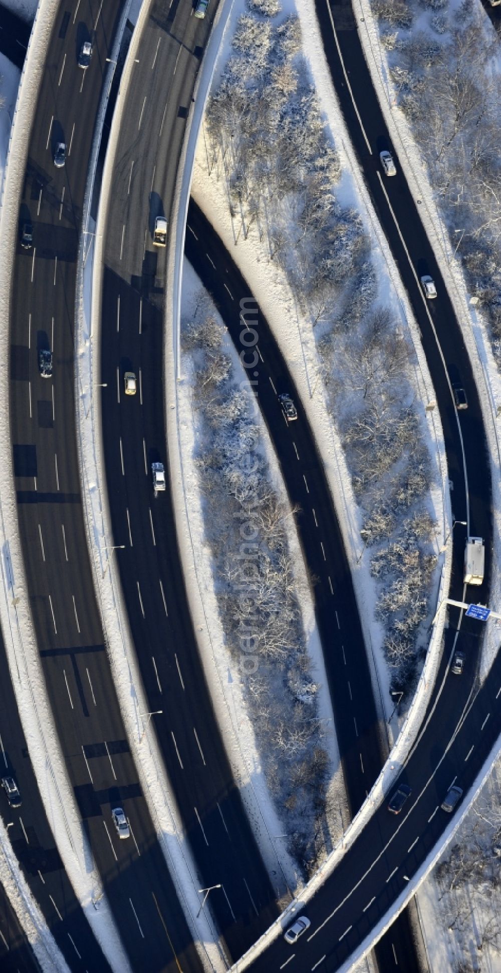 Berlin from the bird's eye view: Wintry snowy highway triangle the federal motorway A 100 to the A115 Autobahndreieck Funkturm in the district Charlottenburg in Berlin, Germany