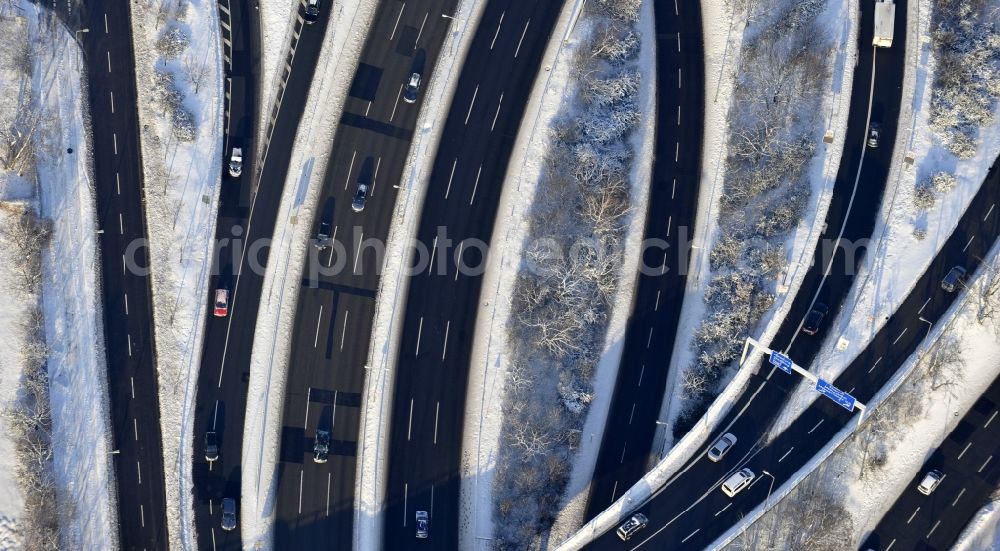 Berlin from above - Wintry snowy highway triangle the federal motorway A 100 to the A115 Autobahndreieck Funkturm in the district Charlottenburg in Berlin, Germany