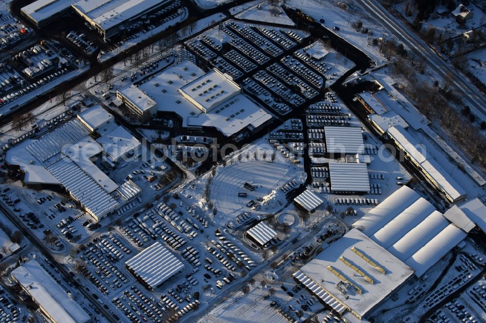 Aerial photograph Hoppegarten - Wintry snowy car dealership building Automobile BCA Autoauktionen GmbH Neuer Hoenower Weg in the district Dahlwitz-Hoppegarten in Hoppegarten in the state Brandenburg