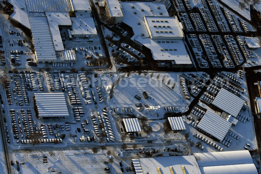 Hoppegarten from the bird's eye view: Wintry snowy car dealership building Automobile BCA Autoauktionen GmbH Neuer Hoenower Weg in the district Dahlwitz-Hoppegarten in Hoppegarten in the state Brandenburg