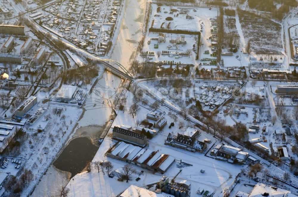 Aerial image Brandenburg an der Havel - Wintry snowy railway bridge building to route the train tracks Silokanal in Brandenburg an der Havel in the state Brandenburg, Germany