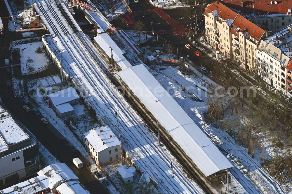 Berlin from the bird's eye view: Wintry snowy station building and track systems of the S-Bahn station on street Bahnhofstrasse in the district Koepenick in Berlin, Germany
