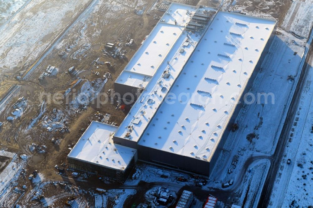 Schwerin from the bird's eye view: Wintry snowy construction of building and production halls on the premises of Ypsomed Produktion GmbH on street Ludwig-Boelkow-Strasse in Schwerin in the state Mecklenburg - Western Pomerania, Germany