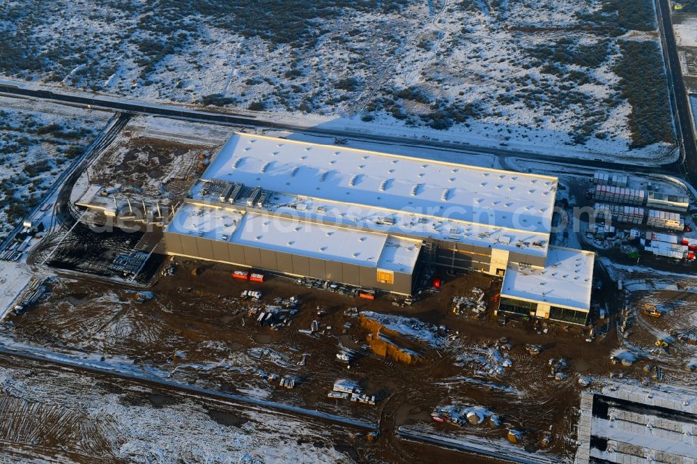 Schwerin from the bird's eye view: Wintry snowy construction of building and production halls on the premises of Ypsomed Produktion GmbH on street Ludwig-Boelkow-Strasse in Schwerin in the state Mecklenburg - Western Pomerania, Germany