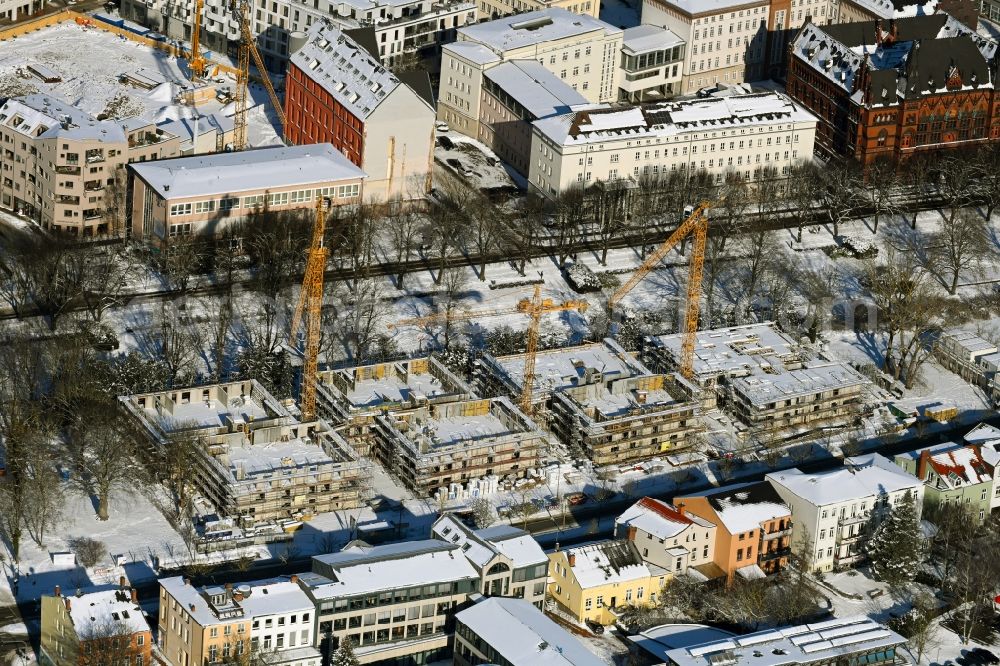 Aerial image Rostock - Wintry snowy construction site to build a new multi-family residential complex Am Rosengarten on August-Bebel-Strasse - Wallstrasse in the district Stadtmitte in Rostock in the state Mecklenburg - Western Pomerania, Germany