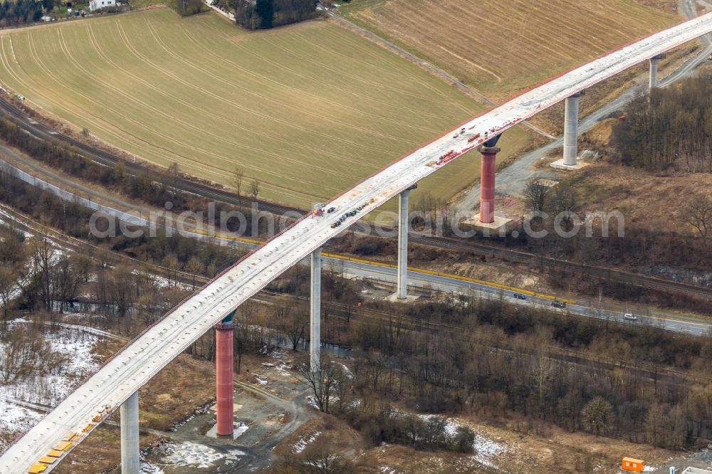 Aerial image Nuttlar - Wintry snowy New construction of the Highway - motorway bridge of the A46 Talbruecke Schormecke - Schormecke Bruecke of BAB A46 in Nuttlar in the state North Rhine-Westphalia, Germany