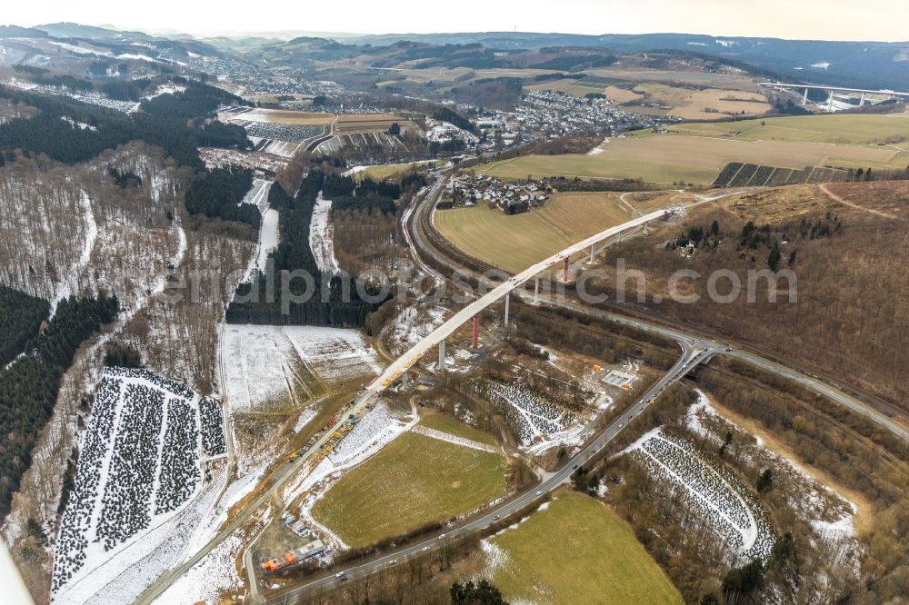 Aerial photograph Nuttlar - Wintry snowy New construction of the Highway - motorway bridge of the A46 Talbruecke Schormecke - Schormecke Bruecke of BAB A46 in Nuttlar in the state North Rhine-Westphalia, Germany