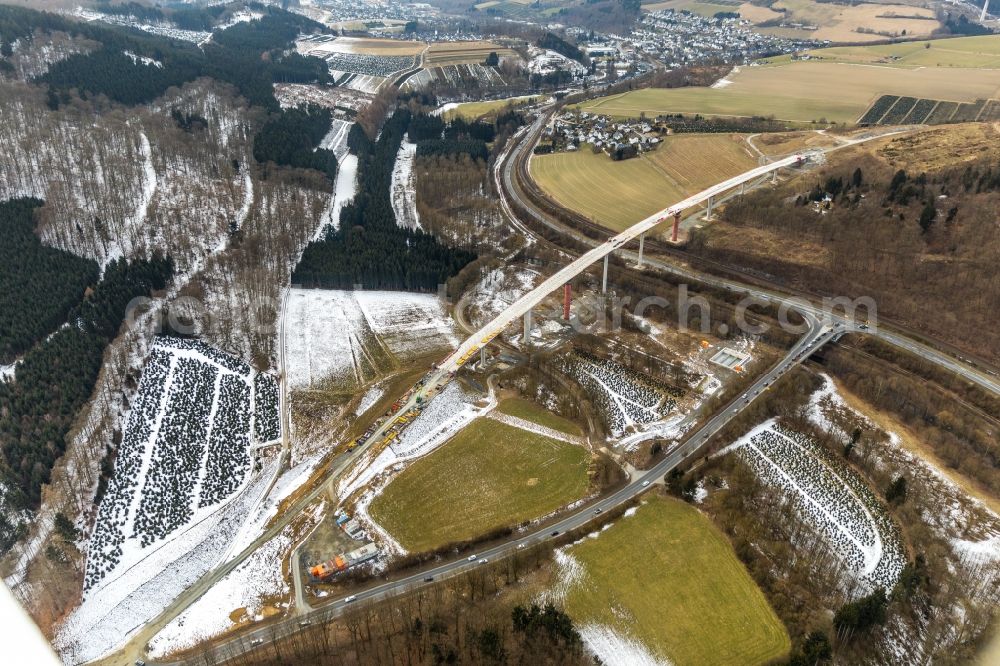 Nuttlar from above - Wintry snowy New construction of the Highway - motorway bridge of the A46 Talbruecke Schormecke - Schormecke Bruecke of BAB A46 in Nuttlar in the state North Rhine-Westphalia, Germany