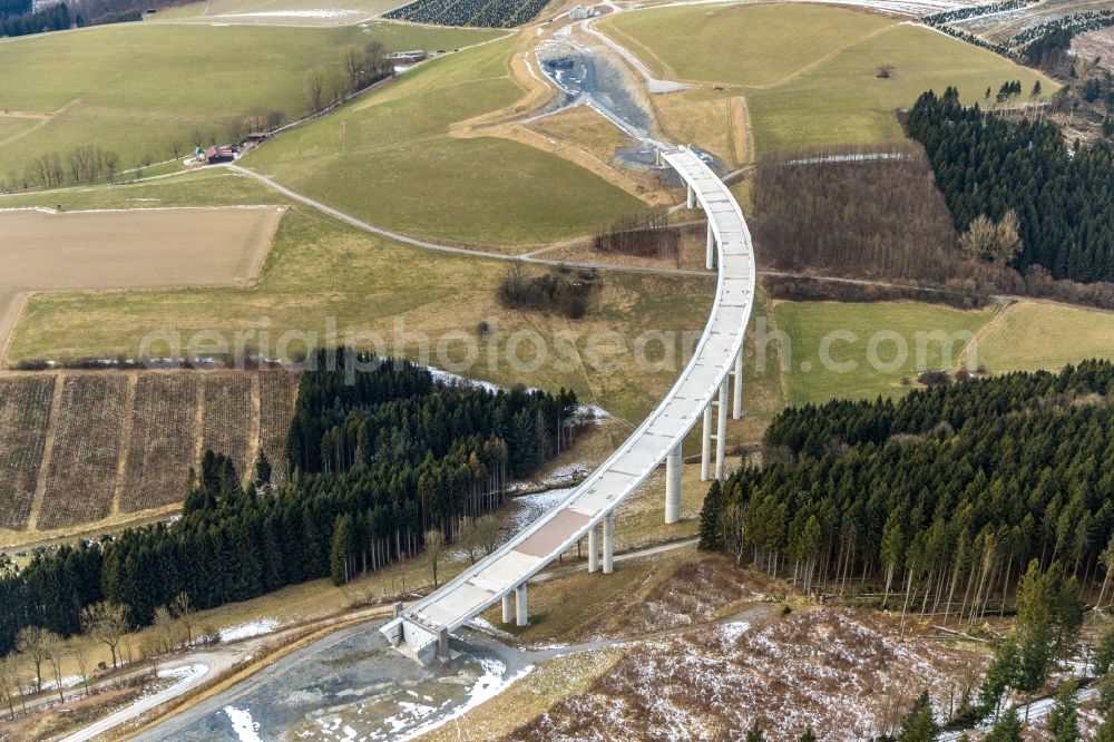 Nuttlar from the bird's eye view: Wintry snowy New construction of the Highway - motorway bridge of the A46 Talbruecke Schormecke - Schormecke Bruecke of BAB A46 in Nuttlar in the state North Rhine-Westphalia, Germany