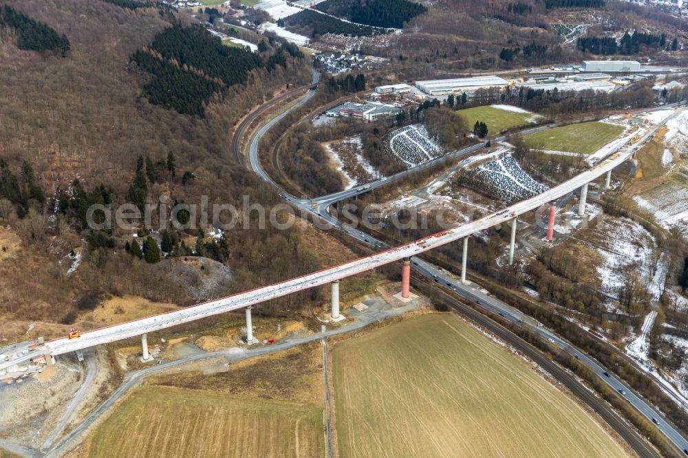 Nuttlar from the bird's eye view: Wintry snowy New construction of the Highway - motorway bridge of the A46 Talbruecke Schormecke - Schormecke Bruecke of BAB A46 in Nuttlar in the state North Rhine-Westphalia, Germany