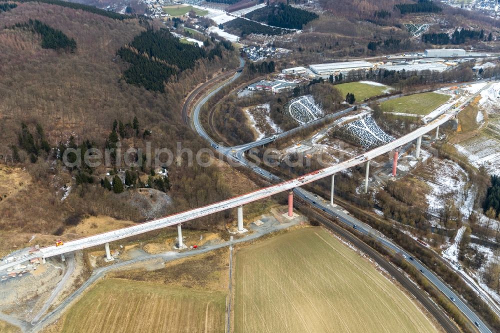 Aerial image Nuttlar - Wintry snowy New construction of the Highway - motorway bridge of the A46 Talbruecke Schormecke - Schormecke Bruecke of BAB A46 in Nuttlar in the state North Rhine-Westphalia, Germany