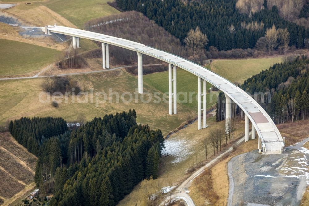 Aerial photograph Nuttlar - Wintry snowy New construction of the Highway - motorway bridge of the A46 Talbruecke Schormecke - Schormecke Bruecke of BAB A46 in Nuttlar in the state North Rhine-Westphalia, Germany