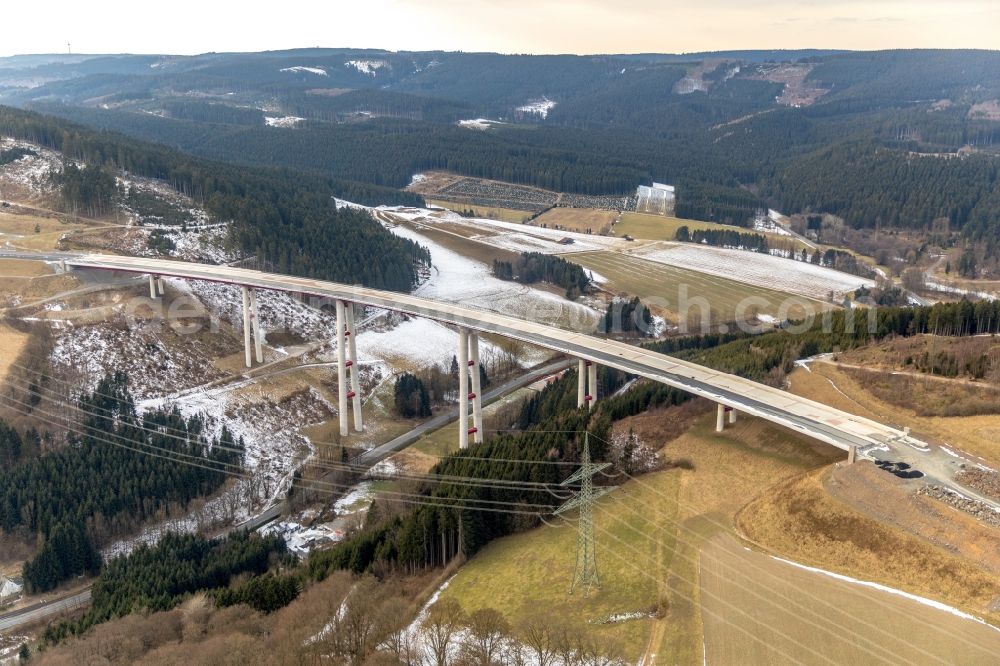 Aerial image Nuttlar - Wintry snowy New construction of the Highway - motorway bridge of the A46 Talbruecke Schormecke - Schormecke Bruecke of BAB A46 in Nuttlar in the state North Rhine-Westphalia, Germany