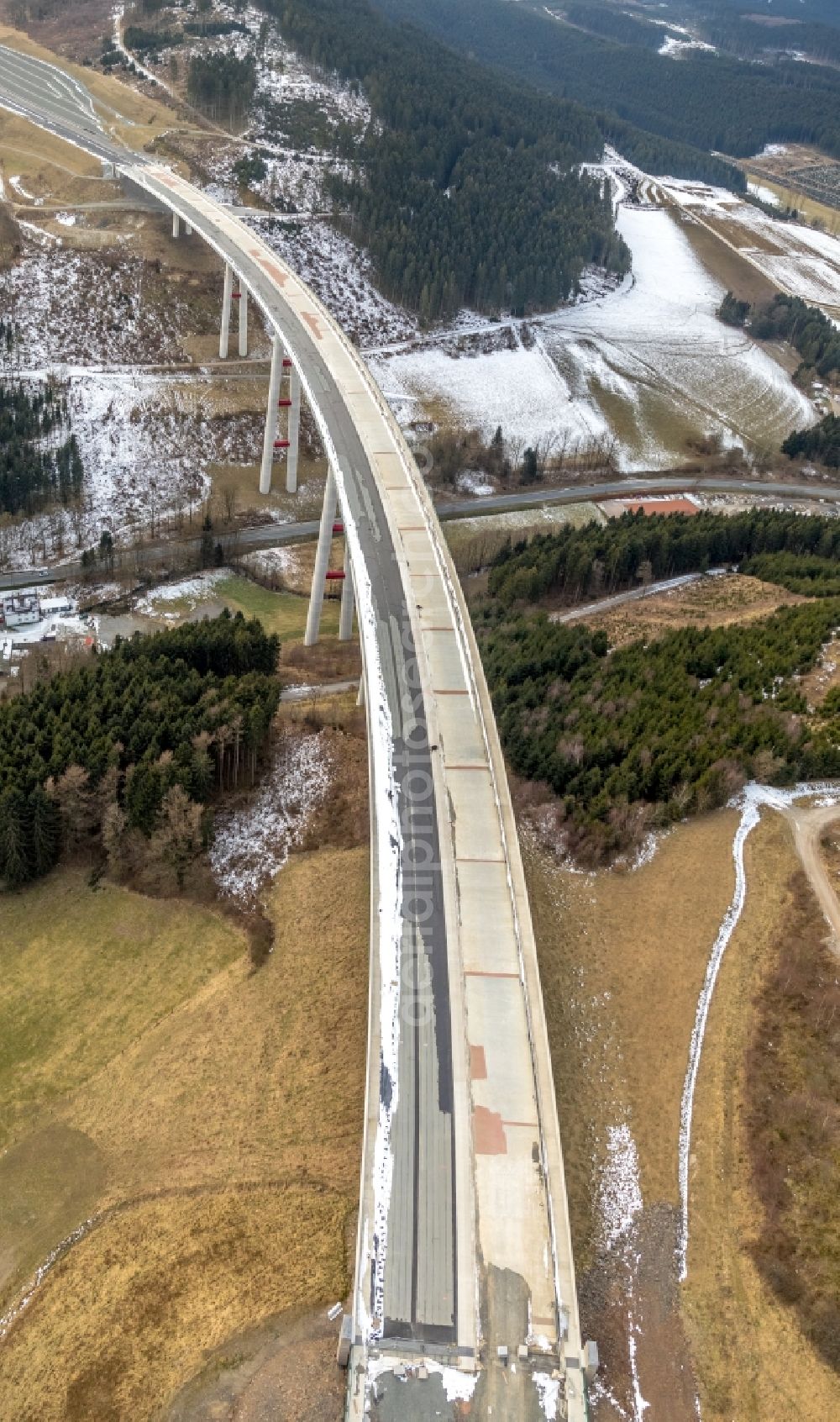 Aerial image Nuttlar - Wintry snowy New construction of the Highway - motorway bridge of the A46 Talbruecke Schormecke - Schormecke Bruecke of BAB A46 in Nuttlar in the state North Rhine-Westphalia, Germany