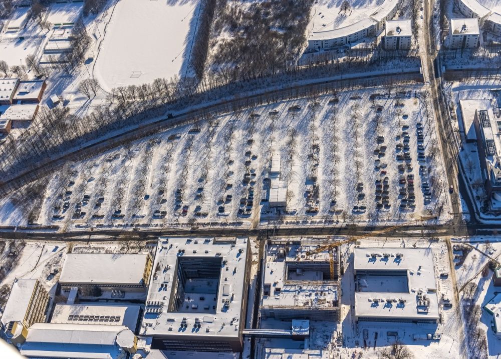 Dortmund from the bird's eye view: Wintry snowy construction site for the new building of a research building and office complex of the TU Dortmund on Otto-Hahn-Strasse in Dortmund in the state North Rhine-Westphalia, Germany