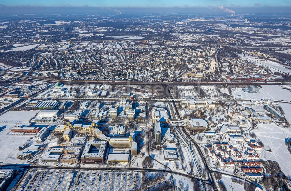 Dortmund from above - Wintry snowy construction site for the new building of a research building and office complex of the TU Dortmund on Otto-Hahn-Strasse in Dortmund in the state North Rhine-Westphalia, Germany