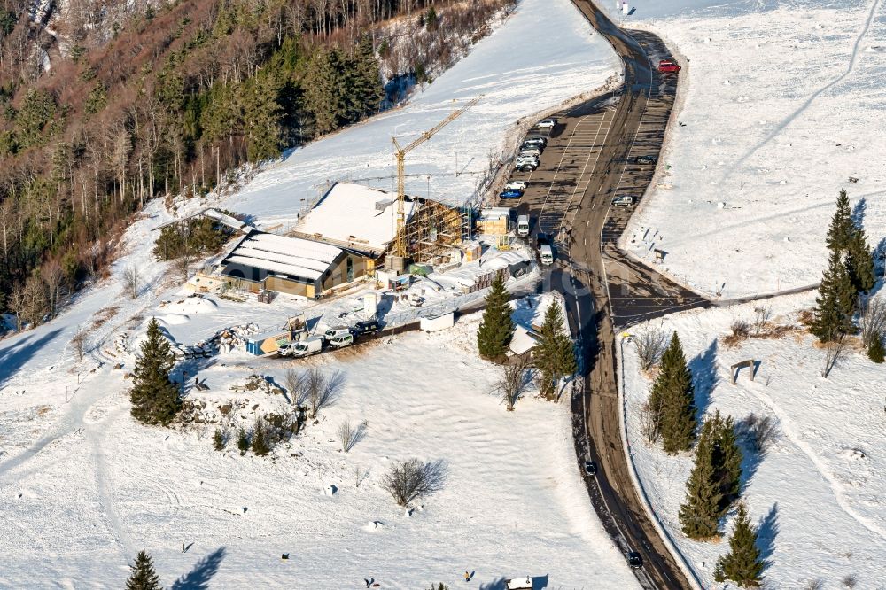 Sankt Peter from above - Wintry snowy new construction site the hotel complex Kandelhotel on Berg Kandel in Sankt Peter in the state Baden-Wuerttemberg, Germany