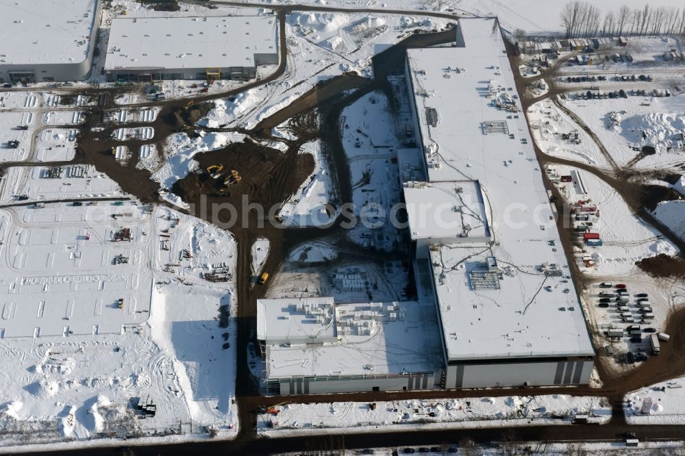 Aerial photograph Berlin - Wintry snowy construction site for the new building home-center of the Porta-Group at Pilgramer street in the district Mahlsdorf in Berlin