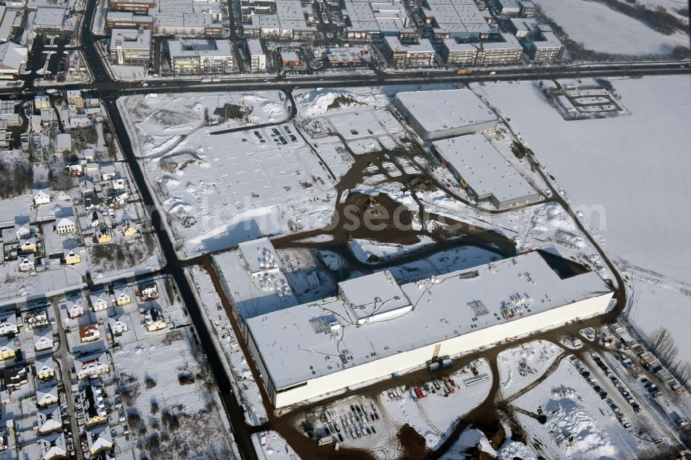 Aerial photograph Berlin - Wintry snowy construction site for the new building home-center of the Porta-Group at Pilgramer street in the district Mahlsdorf in Berlin