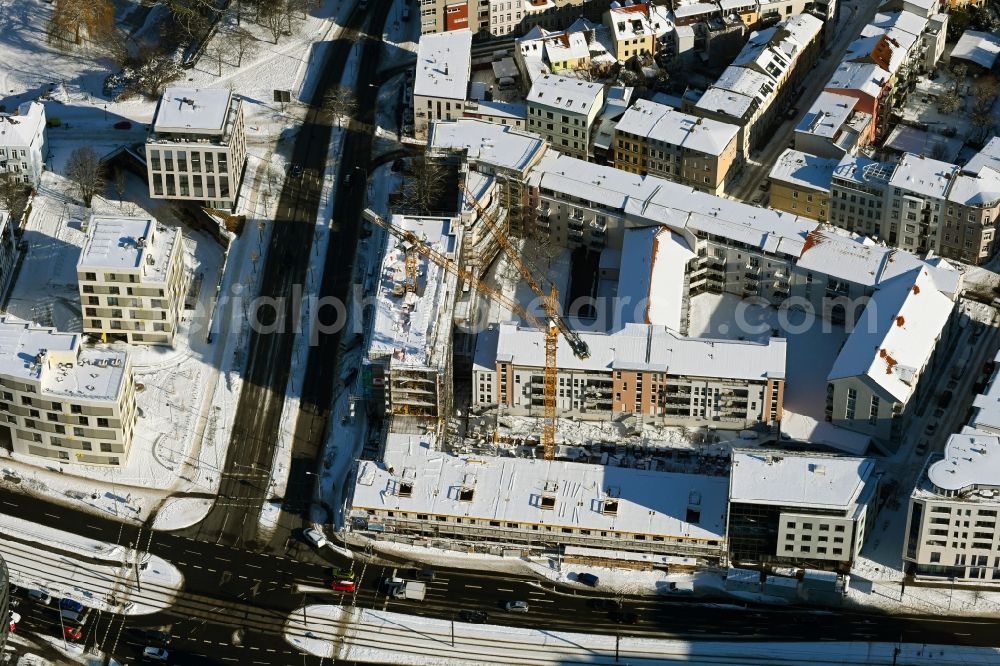 Rostock from above - Wintry snowy construction site to build a new multi-family residential complex of Bouwfonds IM Deutschland GmbH Am Voegenteich - August-Bebel-Strasse in Rostock in the state Mecklenburg - Western Pomerania, Germany