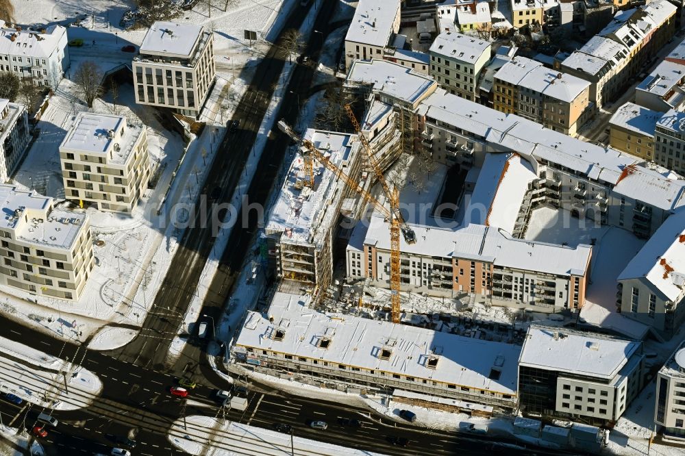 Aerial image Rostock - Wintry snowy construction site to build a new multi-family residential complex of Bouwfonds IM Deutschland GmbH Am Voegenteich - August-Bebel-Strasse in Rostock in the state Mecklenburg - Western Pomerania, Germany