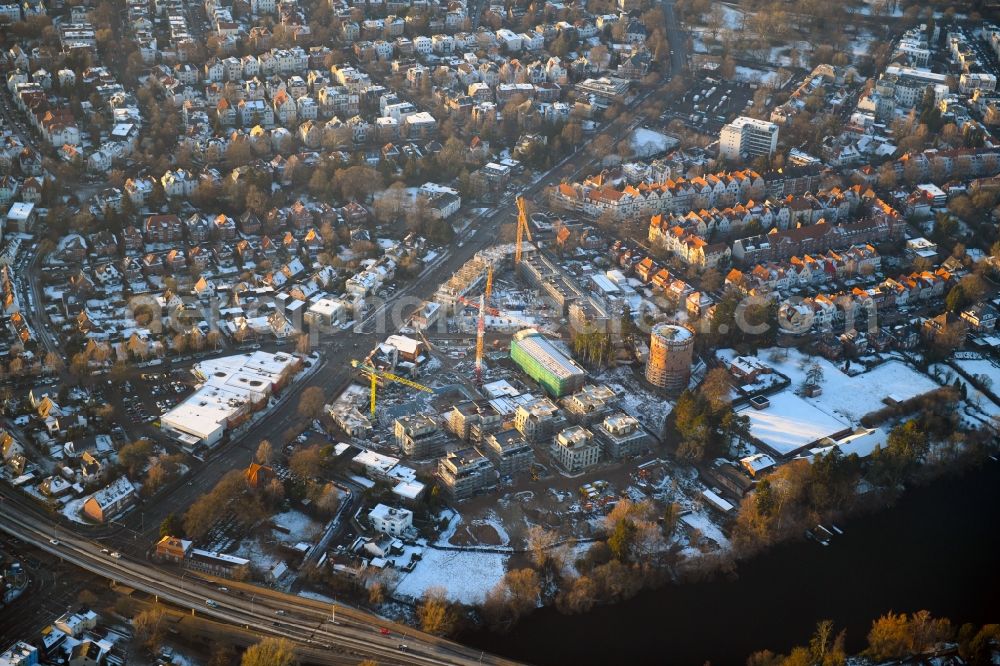 Lübeck from the bird's eye view: Wintry snowy construction site to build a new multi-family residential complex on Ratzeburger Allee - Zum Wasserspeicher in Luebeck in the state Schleswig-Holstein, Germany