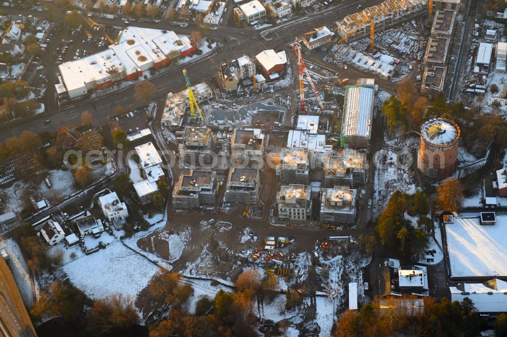 Aerial image Lübeck - Wintry snowy construction site to build a new multi-family residential complex on Ratzeburger Allee - Zum Wasserspeicher in Luebeck in the state Schleswig-Holstein, Germany