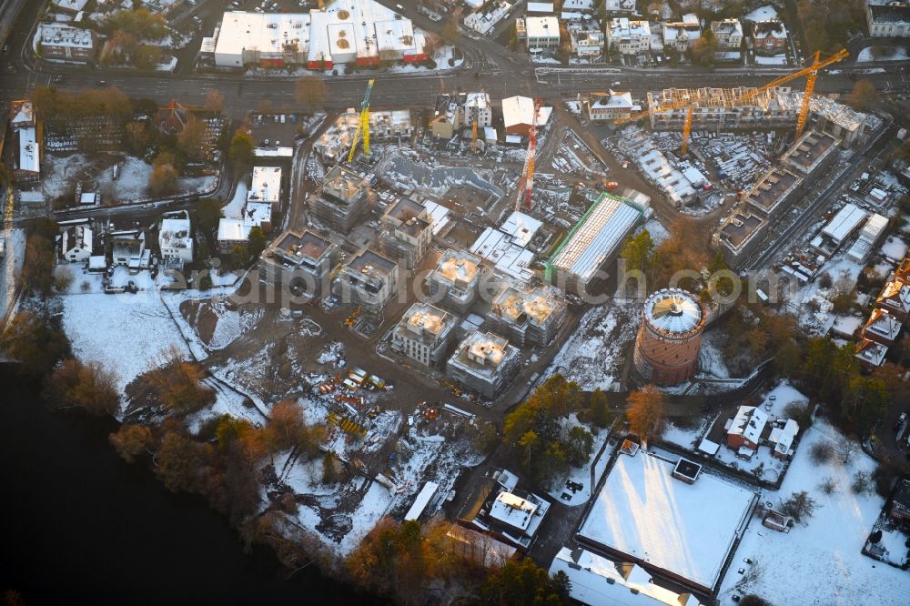 Aerial photograph Lübeck - Wintry snowy construction site to build a new multi-family residential complex on Ratzeburger Allee - Zum Wasserspeicher in Luebeck in the state Schleswig-Holstein, Germany