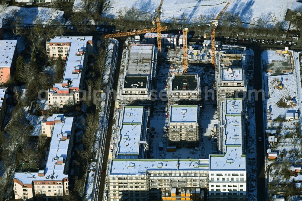 Berlin from above - Wintry snowy construction site to build a new multi-family residential complex Maximilians Quartier on Forckenbeckstrasse in the district Wilmersdorf - Schmargendorf in Berlin, Germany