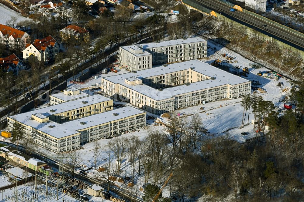 Aerial image Bernau - Wintry snowy construction site to build a new multi-family residential complex Waldquartier Friedenstal-Bernau on Zepernicker Chaussee corner Lenastrasse in Bernau in the state Brandenburg, Germany