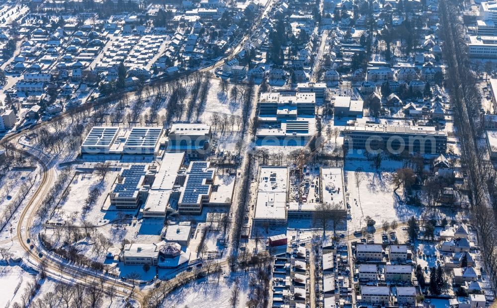 Unna from above - Wintry snowy new construction site of the school building with Continuing Education Center on Bildungscampus Unna in the district Alte Heide in Unna at Ruhrgebiet in the state North Rhine-Westphalia, Germany