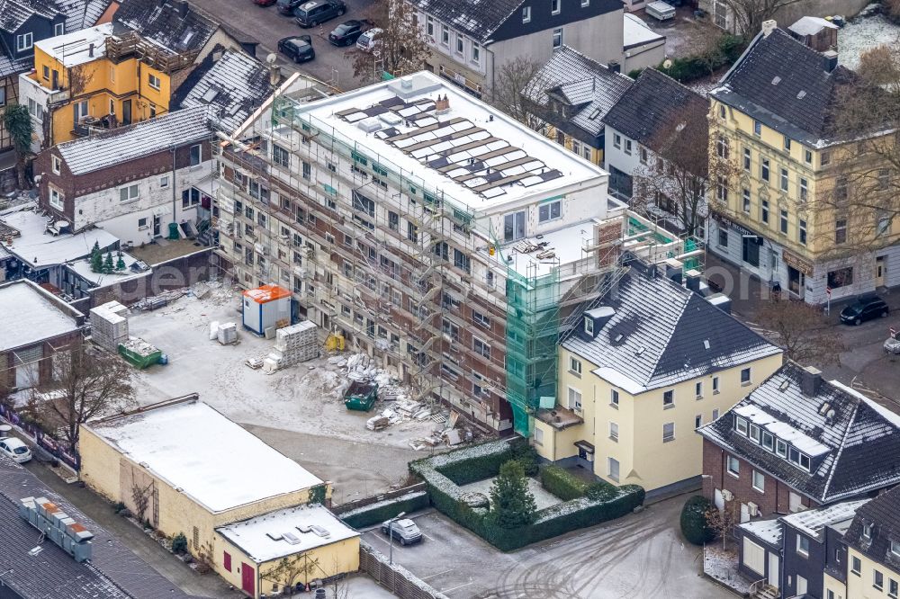 Aerial image Dortmund - Wintry snowy construction site for the multi-family residential building on street Alte Benninghofer Strasse in the district Clarenberg in Dortmund at Ruhrgebiet in the state North Rhine-Westphalia, Germany