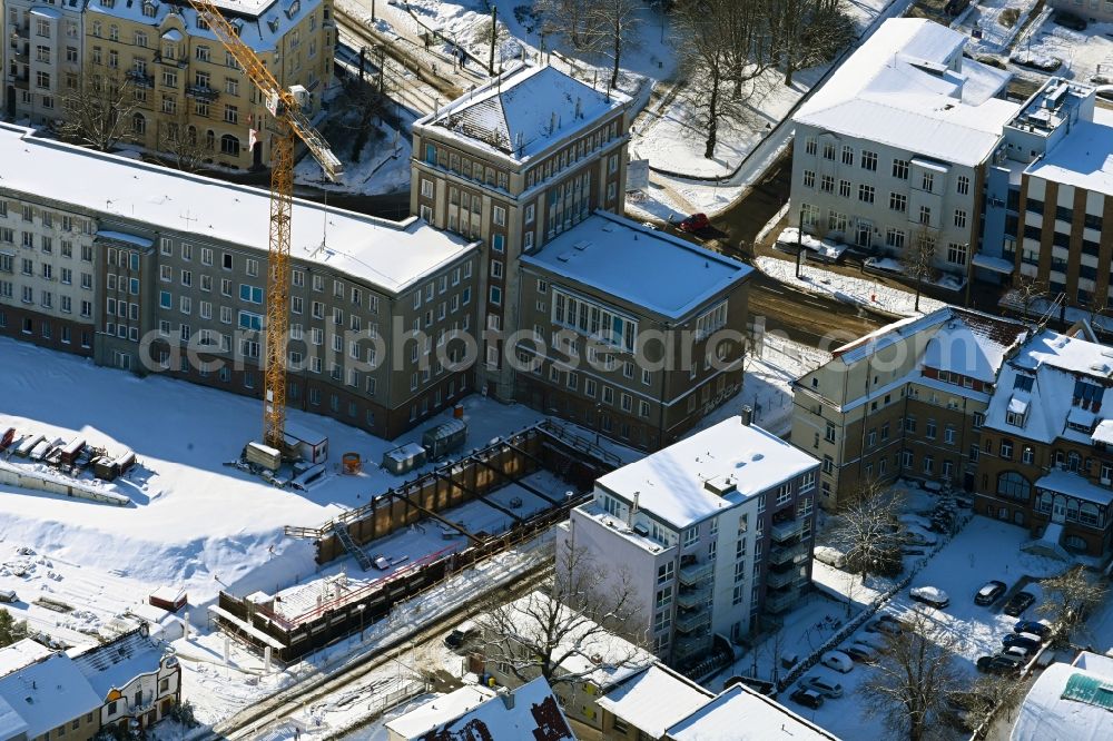 Aerial image Rostock - Wintry snowy construction site for the multi-family residential building Am Gueterbahnhof in Rostock in the state Mecklenburg - Western Pomerania, Germany