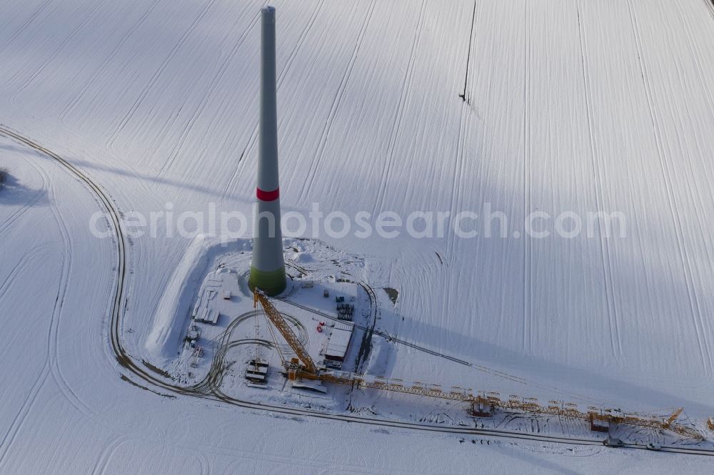 Witzenhausen from above - Wintry snowy Construction site for wind turbine installation in Witzenhausen in the state Hesse, Germany