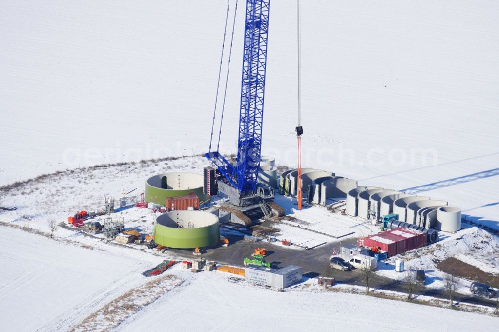 Witzenhausen from above - Wintry snowy Construction site for wind turbine installation in Witzenhausen in the state Hesse, Germany