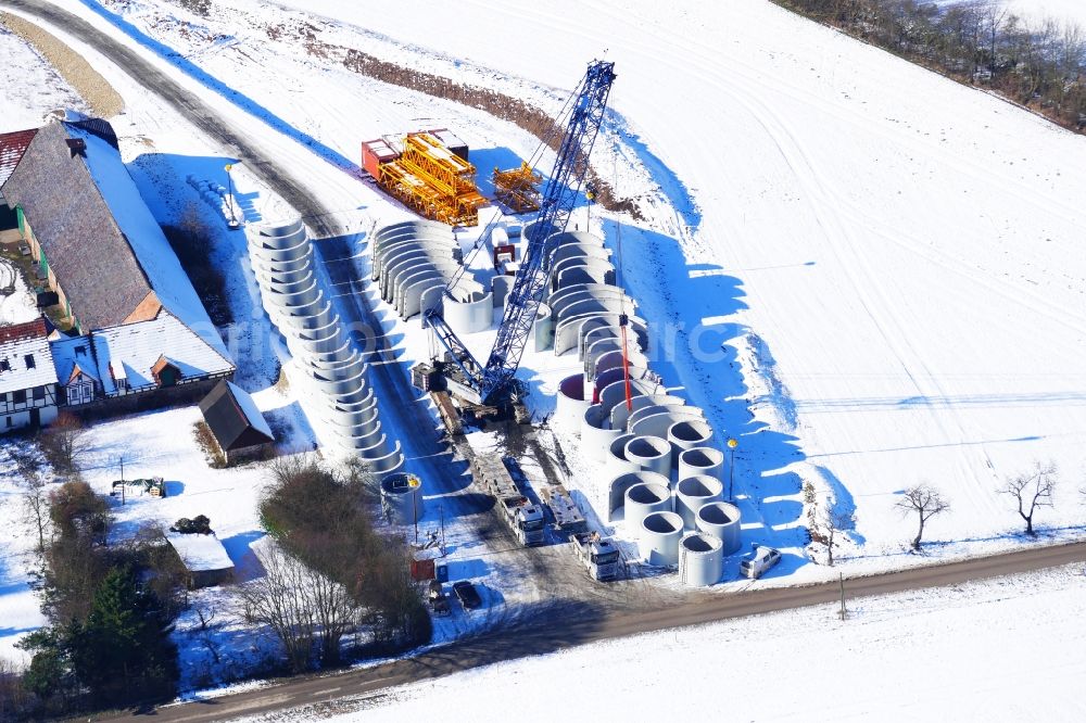 Aerial photograph Witzenhausen - Wintry snowy Construction site for wind turbine installation in Witzenhausen in the state Hesse, Germany