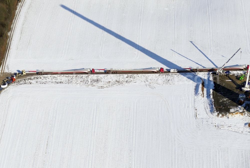 Witzenhausen from the bird's eye view: Wintry snowy Construction site for wind turbine installation in Witzenhausen in the state Hesse, Germany