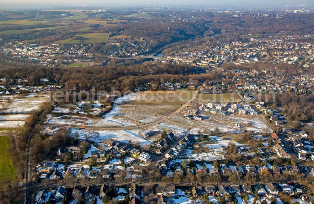 Essen from the bird's eye view: Wintry snowy Construction sites for new construction residential area of detached housing estate Barkhover Feldweg in the district Stadtbezirke IX in Essen in the state North Rhine-Westphalia