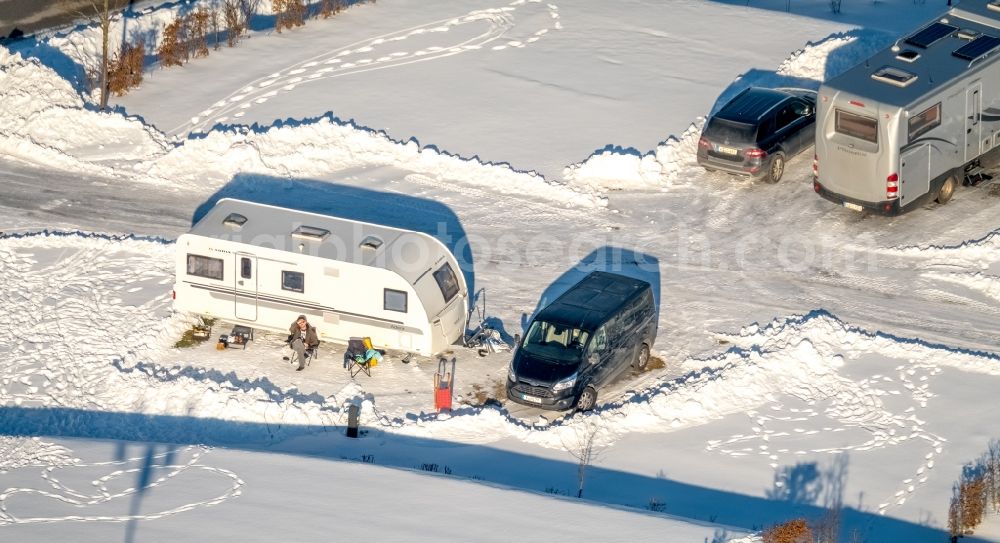 Aerial image Brilon - Wintry snowy construction sites for new construction residential area of detached housing estate in the district Poppenberg in Brilon in the state North Rhine-Westphalia